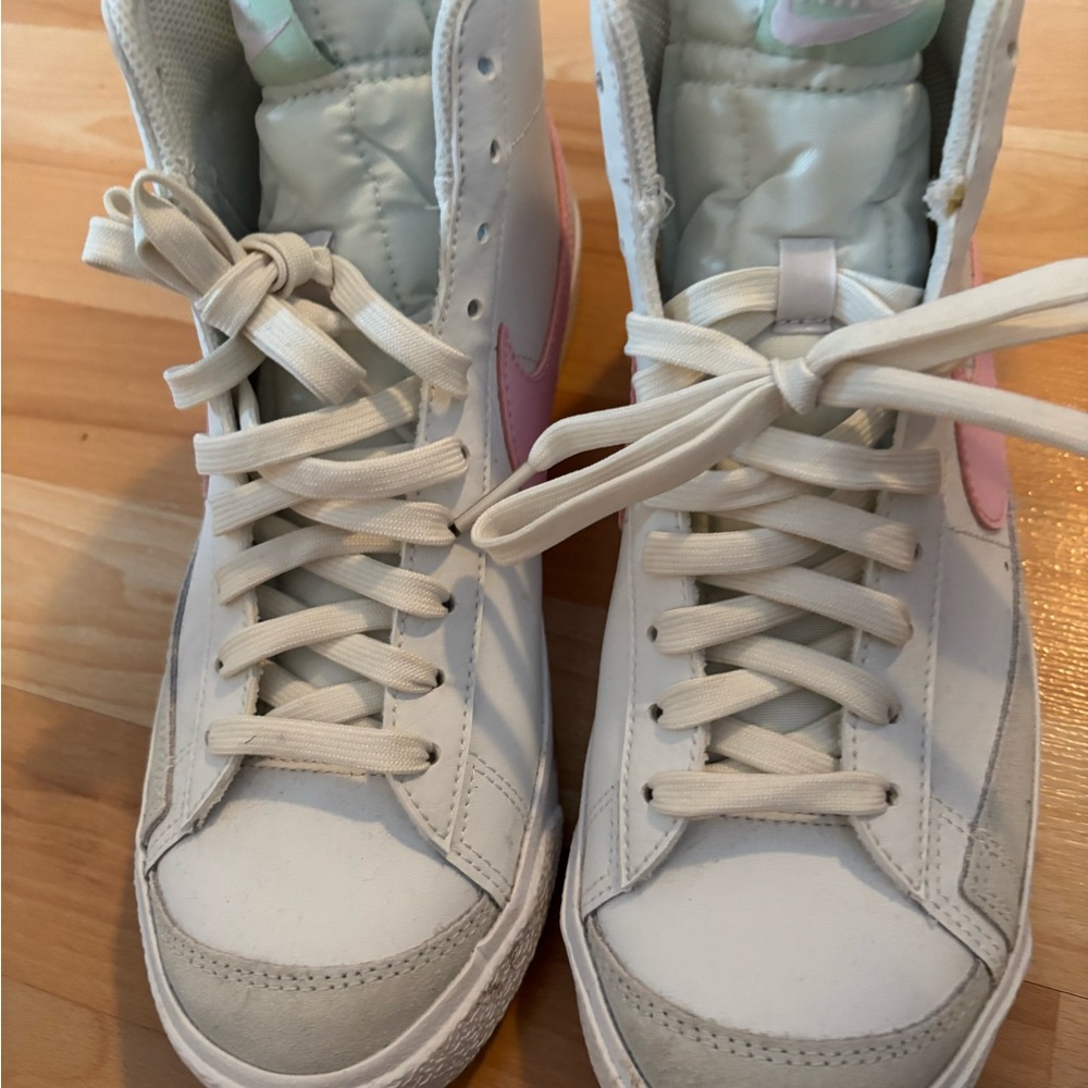 Nike White High-Top Sneakers with Pink Swoosh